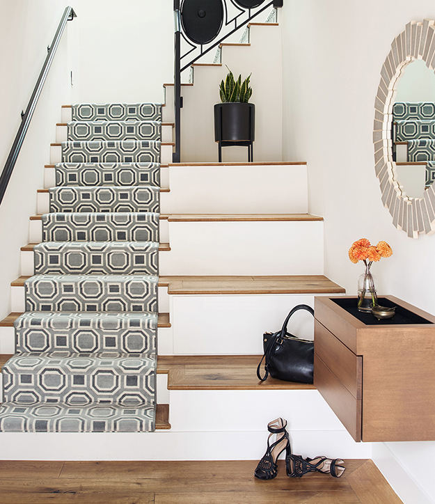 Foyer in Noe Valley San Francisco home with modern furniture and staircase designed by Bay Area interior designers