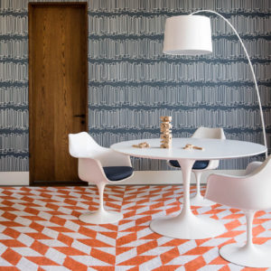 Modern playroom with graphic rug and patterned wallpaper by San Francisco interior designer