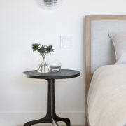 Sculptural bedside table and modern sconce in home designed by Bay Area interior designer Niche Interiors